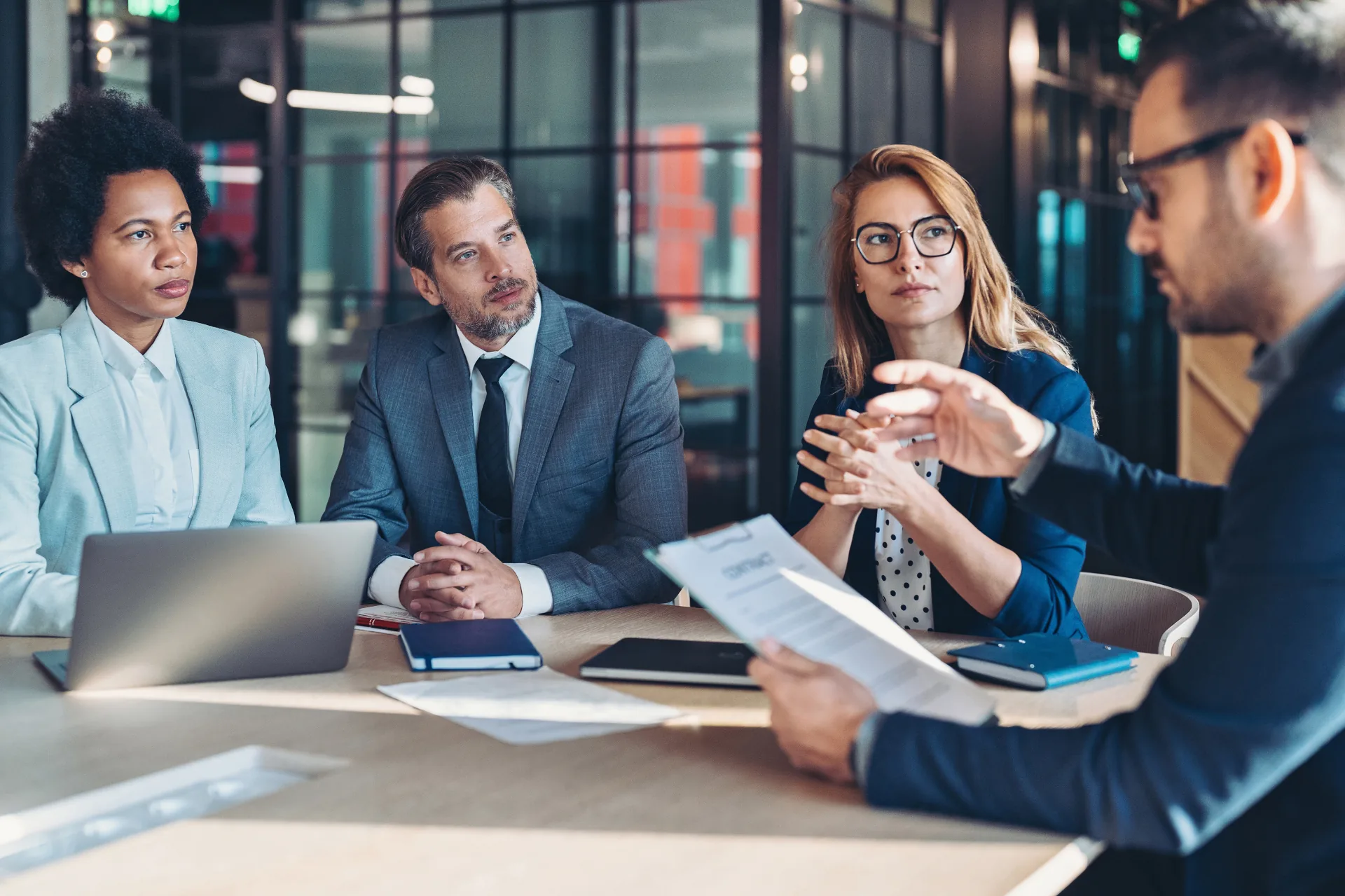 Attorneys and clients meeting around a conference table