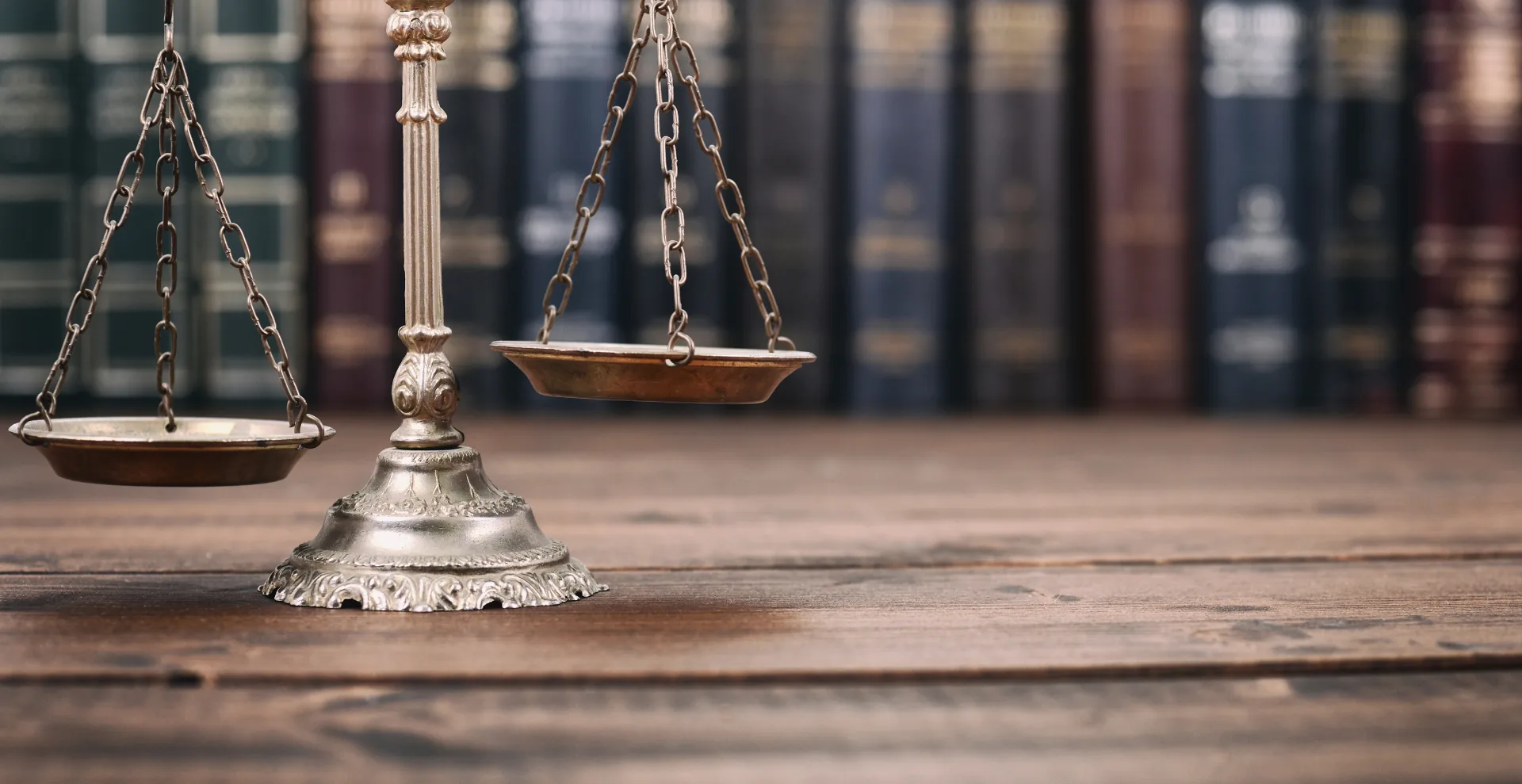 Scales of justice in front of law books